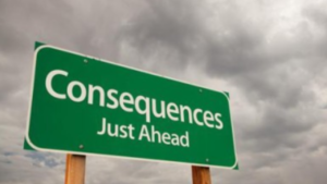 A picture of a green road sign that reads consequences just ahead